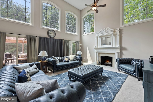 18309 Eldorado Way, Leesburg, VA 20176 - living area featuring high vaulted ceiling, ceiling fan, a lit fireplace, and carpet floors