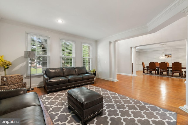 18309 Eldorado Way, Leesburg, VA 20176 - living area featuring decorative columns, wood finished floors, healthy amount of natural light, and ornamental molding