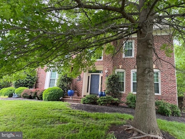 18309 Eldorado Way, Leesburg, VA 20176 - view of front of house featuring brick siding and a front yard