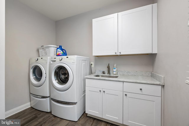 18309 Eldorado Way, Leesburg, VA 20176 - washroom featuring cabinet space, washer and clothes dryer, dark wood-style flooring, and baseboards