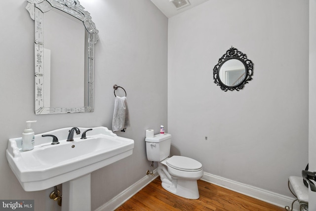 18309 Eldorado Way, Leesburg, VA 20176 - bathroom featuring toilet, wood finished floors, baseboards, and a sink