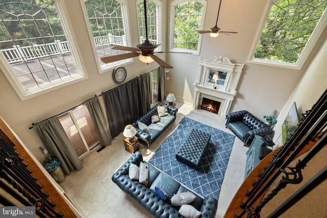 18309 Eldorado Way, Leesburg, VA 20176 - living area featuring ceiling fan, carpet flooring, a high ceiling, and a fireplace with flush hearth