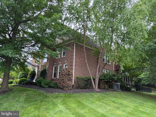 18309 Eldorado Way, Leesburg, VA 20176 - view of side of property with a lawn and brick siding
