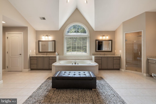 18309 Eldorado Way, Leesburg, VA 20176 - full bath with lofted ceiling, a stall shower, tile patterned flooring, and two vanities