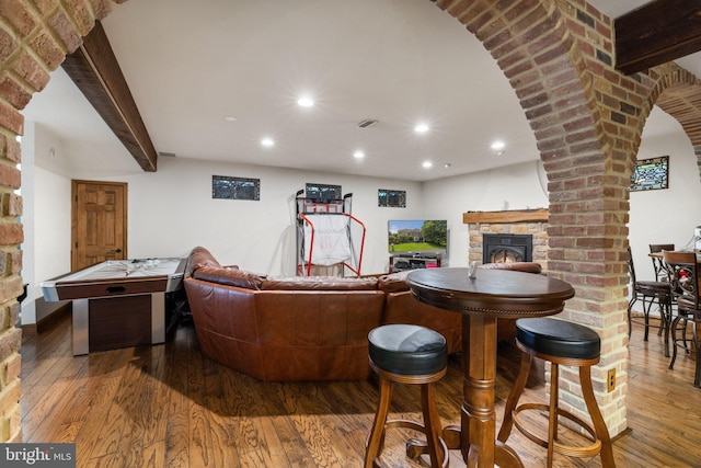 18309 Eldorado Way, Leesburg, VA 20176 - living area featuring a warm lit fireplace, hardwood / wood-style flooring, recessed lighting, and arched walkways