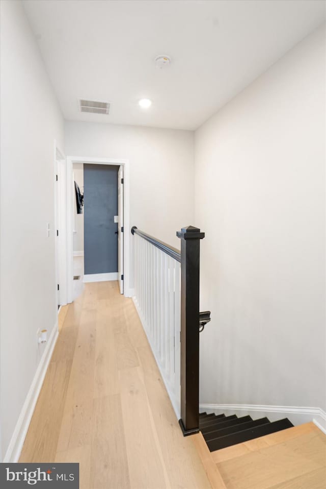 2627 Loyola Northway, Baltimore, MD 21215 - hallway with light wood-style floors, an upstairs landing, baseboards, and recessed lighting
