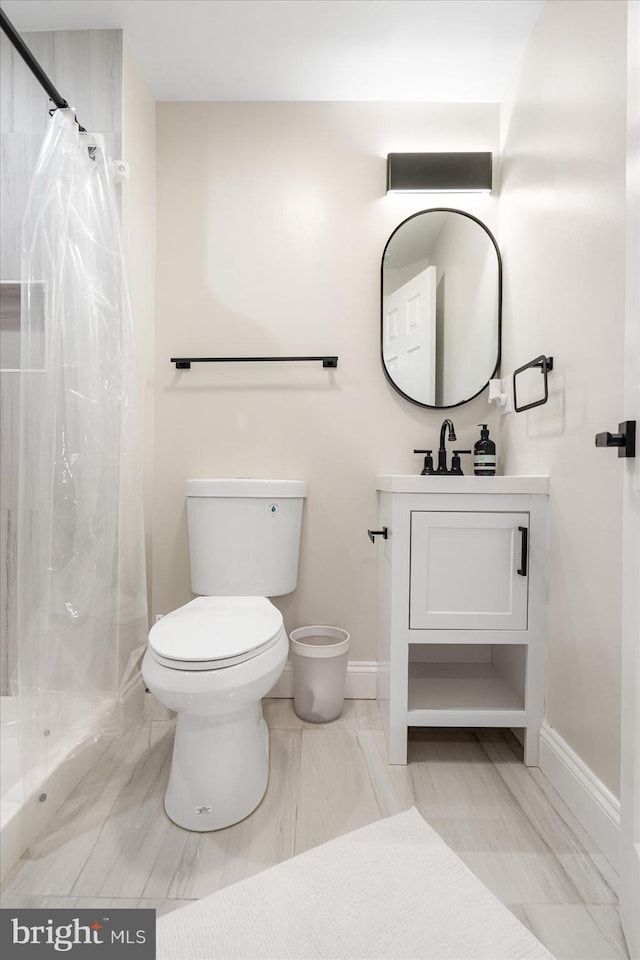 2627 Loyola Northway, Baltimore, MD 21215 - full bath featuring toilet, baseboards, and a shower stall