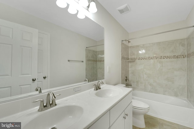 full bathroom featuring toilet, bathtub / shower combination, and double vanity