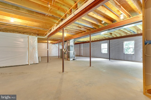 below grade area with water heater and heating unit