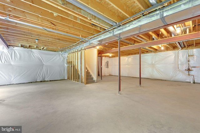 unfinished below grade area featuring stairway