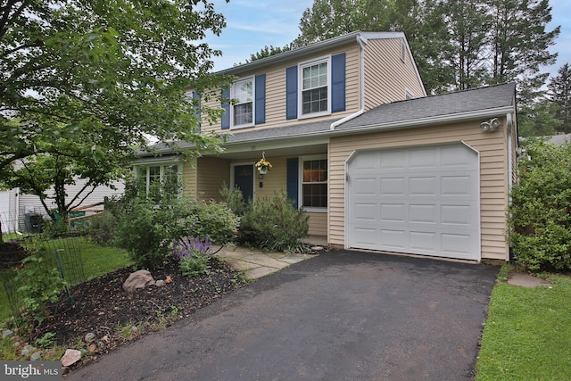 35 Alberts Way, Langhorne, PA 19047 - traditional home featuring a garage, asphalt driveway, and covered porch