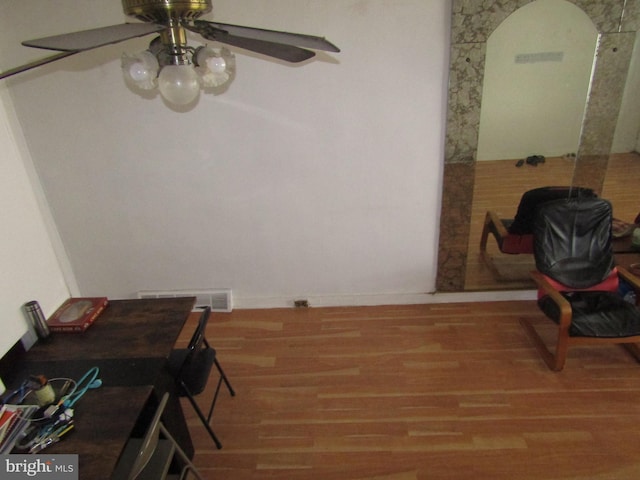 dining area featuring ceiling fan and wood finished floors