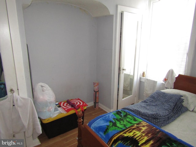 bedroom featuring wood finished floors