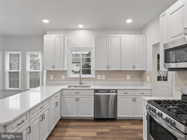 9365 River Crest Rd, Manassas, VA 20110 - kitchen featuring appliances with stainless steel finishes, a sink, white cabinetry, light countertops, and recessed lighting