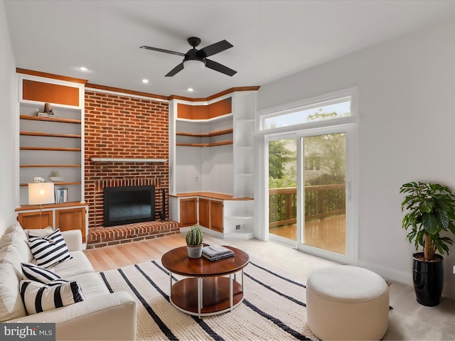 9365 River Crest Rd, Manassas, VA 20110 - living area featuring a ceiling fan, built in features, recessed lighting, a brick fireplace, and wood finished floors