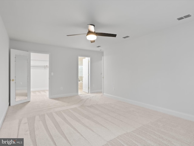 9365 River Crest Rd, Manassas, VA 20110 - unfurnished bedroom with a spacious closet, light carpet, baseboards, a closet, and ceiling fan