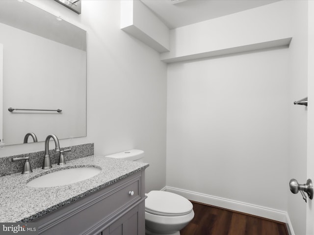9365 River Crest Rd, Manassas, VA 20110 - bathroom with toilet, baseboards, vanity, and wood finished floors