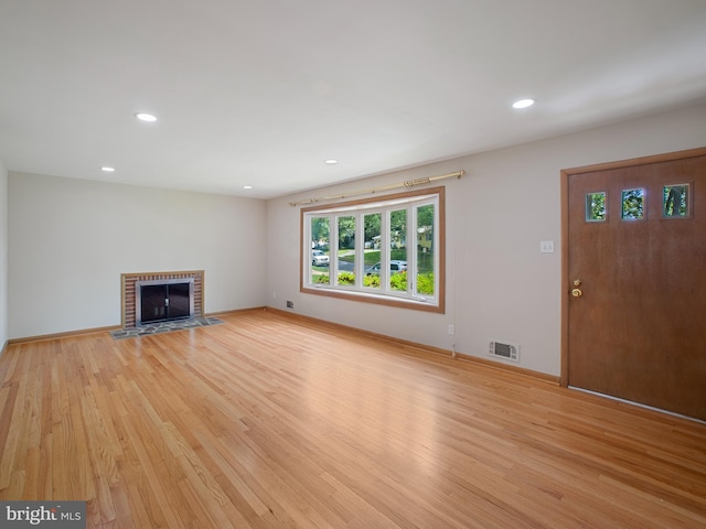 304 Mangrove Rd, Severna Park, MD 21146 - unfurnished living room with light wood finished floors, recessed lighting, a brick fireplace, and baseboards