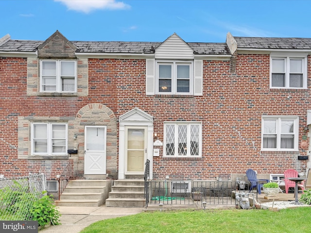146 Academy Rd, Clifton Heights, PA 19018 - view of property featuring entry steps, brick siding, a high end roof, and fence