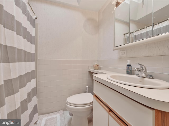 146 Academy Rd, Clifton Heights, PA 19018 - full bath featuring tile walls, tile patterned flooring, vanity, toilet, and wainscoting