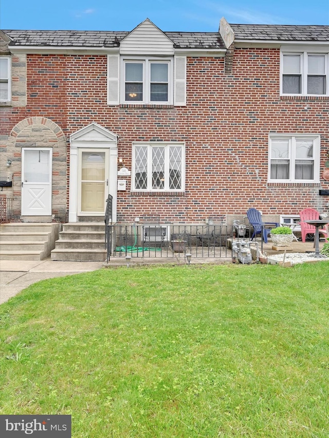 146 Academy Rd, Clifton Heights, PA 19018 - view of property featuring entry steps, brick siding, and a front lawn