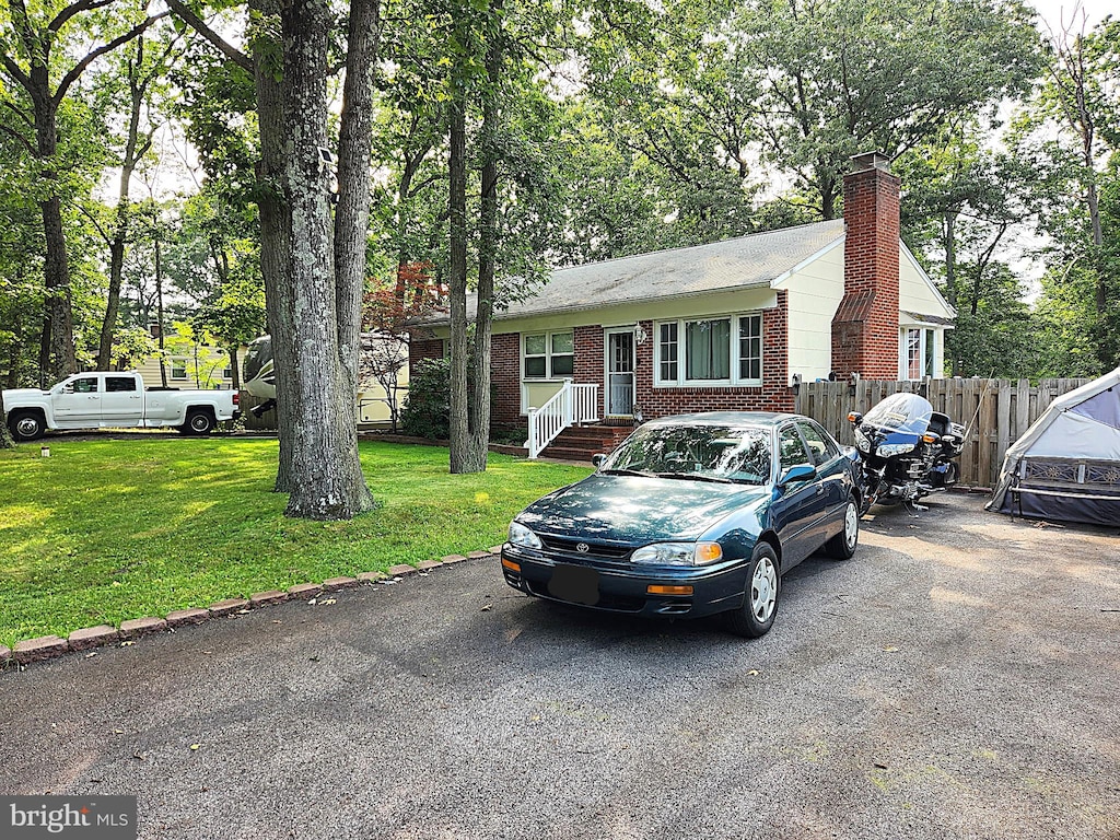 654 Rossburg Ct, Pasadena, MD 21122 - view of front of home with brick siding and a chimney