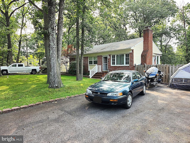 654 Rossburg Ct, Pasadena, MD 21122 - view of front of home with brick siding and a chimney