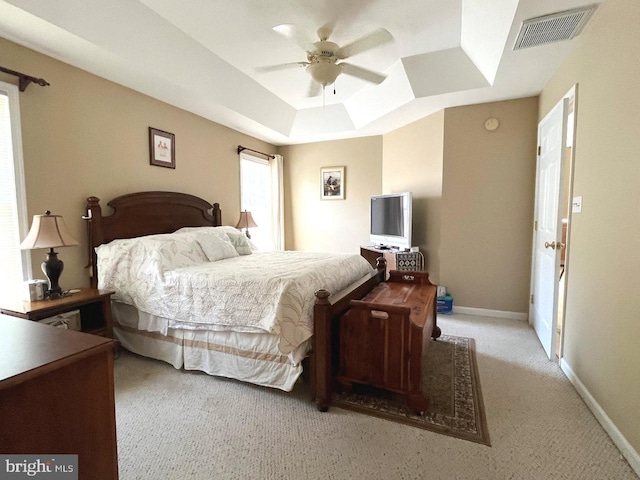 10127 Godspeed Dr, Ocean City, MD 21842 - carpeted bedroom with a tray ceiling, baseboards, and a ceiling fan