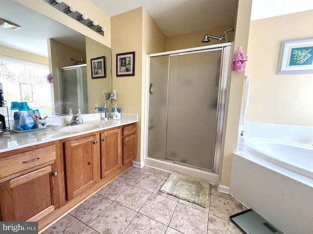10127 Godspeed Dr, Ocean City, MD 21842 - bathroom with a shower stall, tile patterned flooring, vanity, a bath, and baseboards