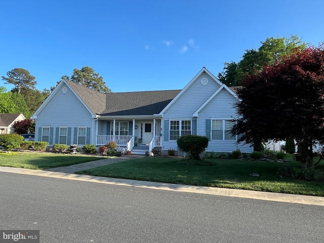 10127 Godspeed Dr, Ocean City, MD 21842 - single story home featuring a porch, a front yard, and roof with shingles