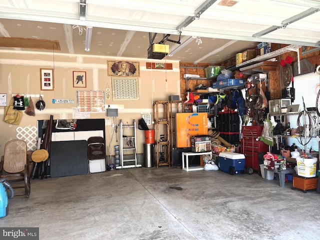 10127 Godspeed Dr, Ocean City, MD 21842 - garage with a garage door opener and a workshop area