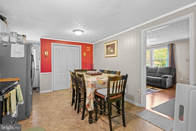 9505 Oakridge Ct, Newburg, MD 20664 - dining space with ornamental molding, a textured ceiling, and light floors