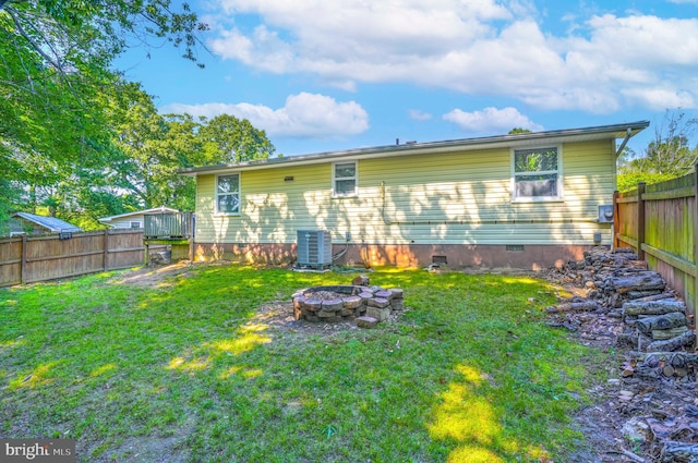 9505 Oakridge Ct, Newburg, MD 20664 - rear view of house featuring crawl space, an outdoor fire pit, and cooling unit