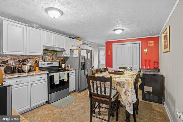 9505 Oakridge Ct, Newburg, MD 20664 - kitchen featuring stainless steel appliances, under cabinet range hood, white cabinets, crown molding, and a textured ceiling
