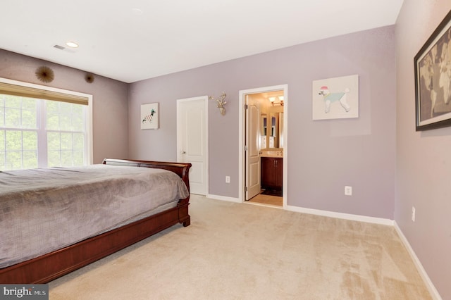 23166 Glenorchy Ct, Ashburn, VA 20148 - bedroom featuring light colored carpet, baseboards, and connected bathroom