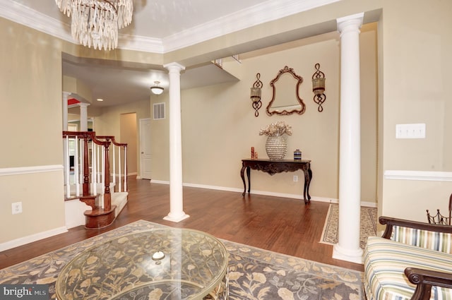 23166 Glenorchy Ct, Ashburn, VA 20148 - foyer entrance with decorative columns, wood finished floors, crown molding, baseboards, and a chandelier