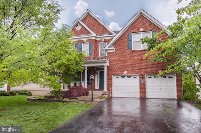 23166 Glenorchy Ct, Ashburn, VA 20148 - view of front of home with asphalt driveway, a garage, a front yard, and brick siding