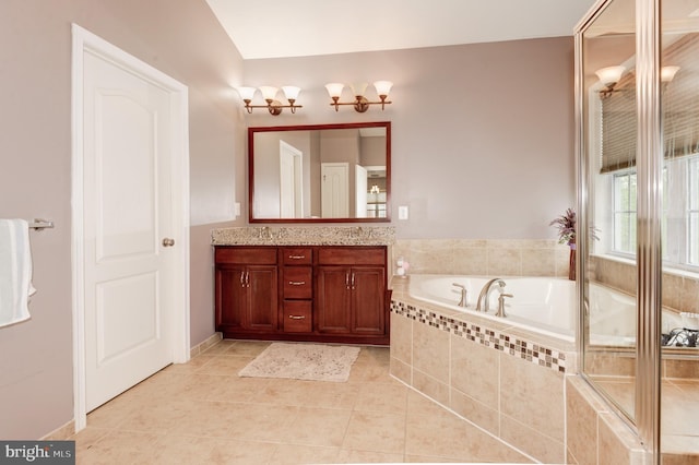 23166 Glenorchy Ct, Ashburn, VA 20148 - bathroom with double vanity, a garden tub, and tile patterned flooring