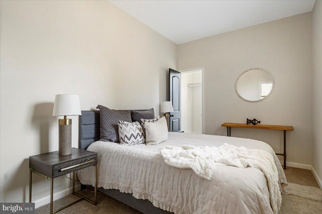 carpeted bedroom featuring baseboards