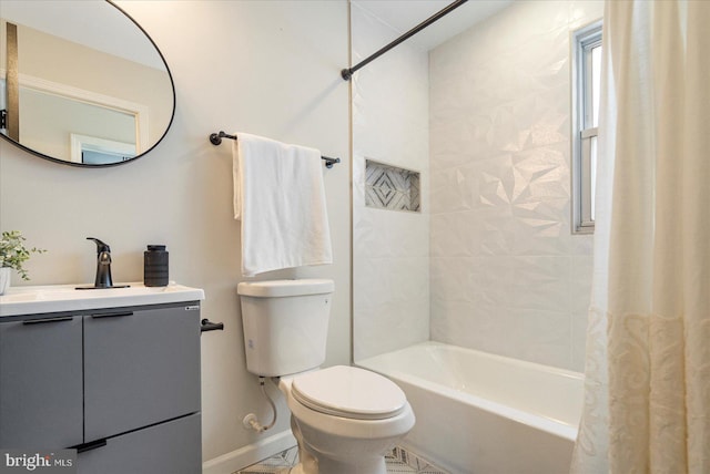full bathroom featuring shower / bath combo, toilet, vanity, and baseboards