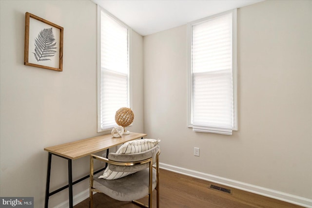 office space featuring wood finished floors and baseboards