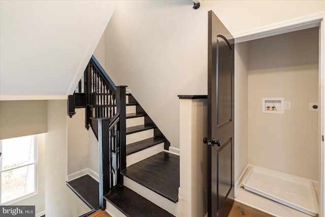 stairs with baseboards and wood finished floors