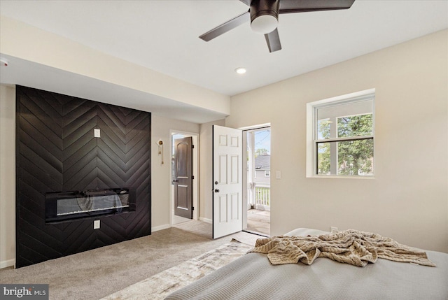 bedroom with carpet flooring, baseboards, a ceiling fan, and access to exterior