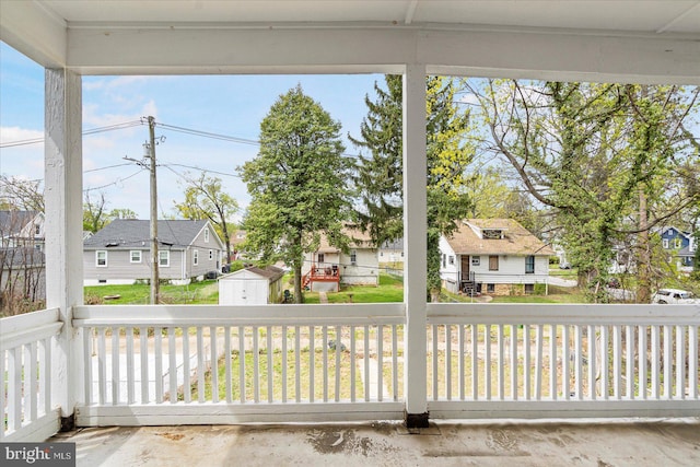 unfurnished sunroom featuring a residential view