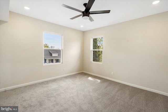 carpeted spare room with baseboards, ceiling fan, and recessed lighting