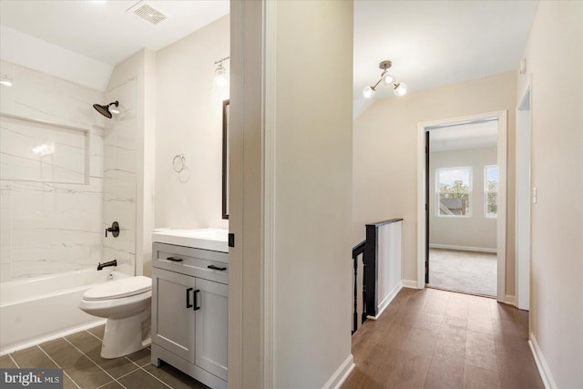 full bath featuring vanity, toilet, and tub / shower combination