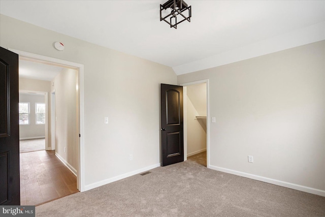 unfurnished bedroom with baseboards and carpet floors