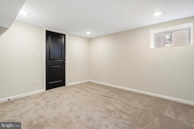 finished below grade area featuring carpet floors, baseboards, and recessed lighting