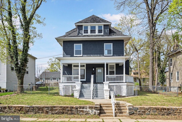 american foursquare style home featuring stairway, a shingled roof, and a porch