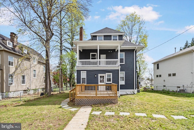 rear view of house featuring a balcony, a wooden deck, a chimney, roof with shingles, and central AC unit